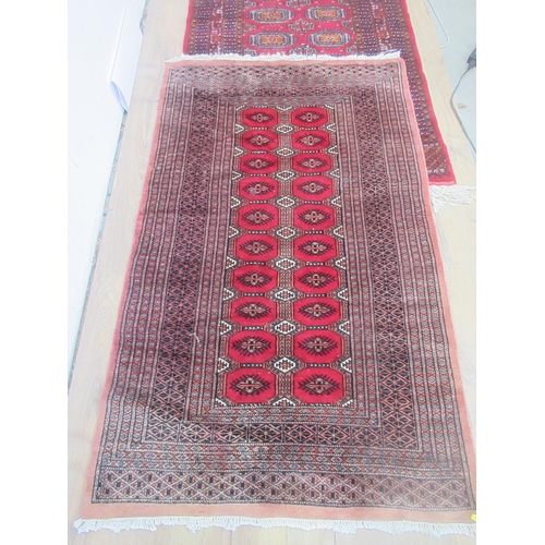 3 - Two Sarouk type red ground Rugs with multi-borders and fields of guls, approx 5ft x 3ft