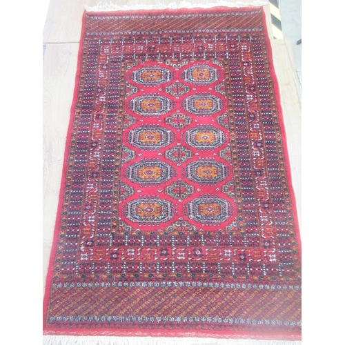 3 - Two Sarouk type red ground Rugs with multi-borders and fields of guls, approx 5ft x 3ft