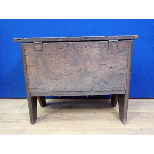 303A - A small antique oak Coffer with hinged cover and carved front, 2ft 1in W