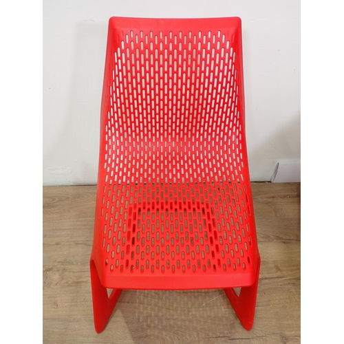 312 - A set of Myto red plastic Chairs with pierced design