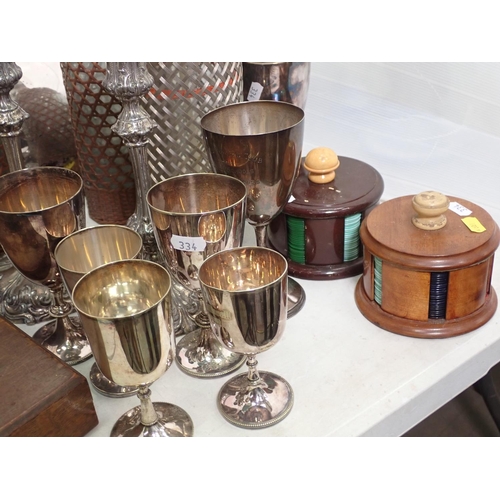 334 - A plated Meat Cover, a Sparklers Soda Syphon, a pair of Candlesticks, a silver Goblet presented by t... 