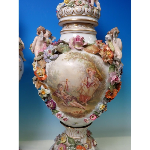 335 - A pair of Continental floral and cherub encrusted lidded Vases, A/F