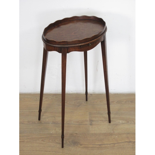 37 - A 19th Century mahogany oval Kettle Stand with pull-out slide on squared tapering supports