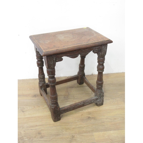 38 - An old oak Joint Stool in the 17th Century style with shaped frieze, turned supports and squared str... 