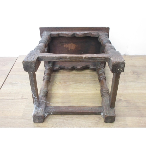 38 - An old oak Joint Stool in the 17th Century style with shaped frieze, turned supports and squared str... 