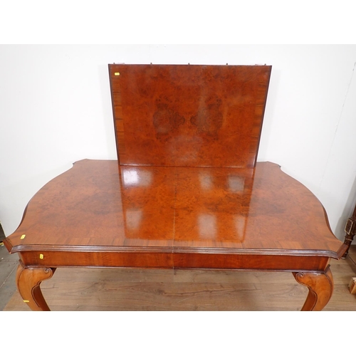 399 - A 1920's walnut Dining Suite comprising extending Table and four Chairs, 6ft 7in including leaf x 3f... 