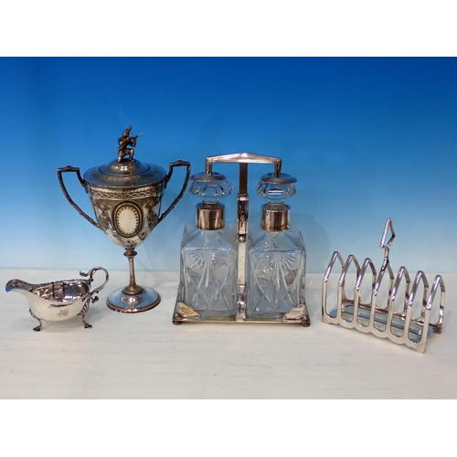 400 - A box of various plated ware including a double Decanter, two handled Trophy, Toast Rack, etc