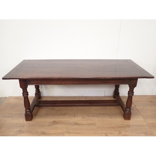 410 - An oak Refectory Table with baluster turned supports and H-stretcher, 6ft 7in x 2ft 11in