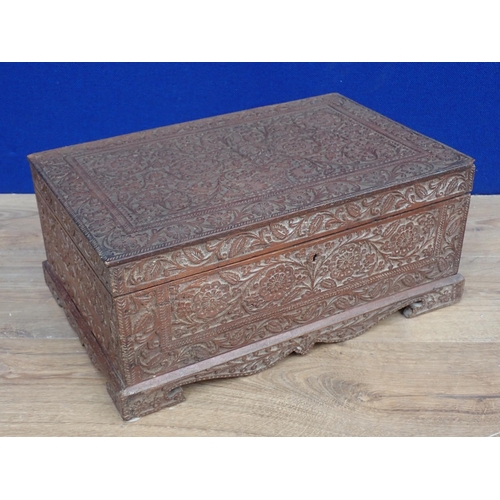 415 - A large Indian carved Dressing Box with hinged cover opening to reveal hinged mirror and covered com... 