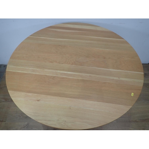 427 - A modern oak circular Dining Table on on cross base, 3ft 7in diam