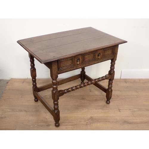 442A - An 18th Century oak Side Table with moulded single frieze drawer on bobbin turned supports and front... 