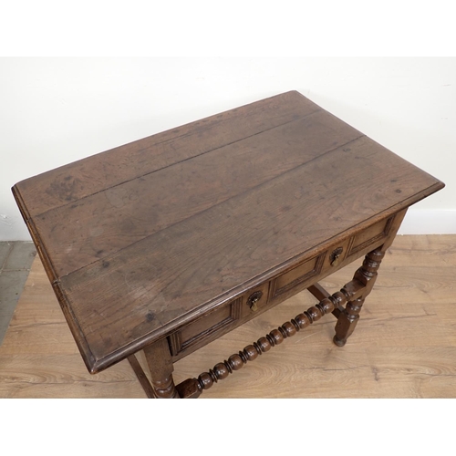 442A - An 18th Century oak Side Table with moulded single frieze drawer on bobbin turned supports and front... 