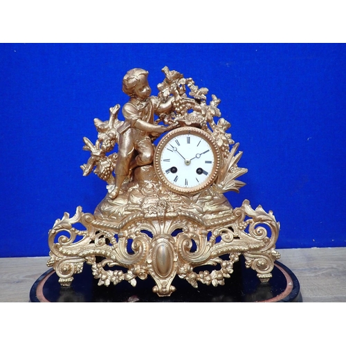 446 - A French style gilt metal Mantel Clock with figure of a boy beside the dial under glass dome, dome A... 