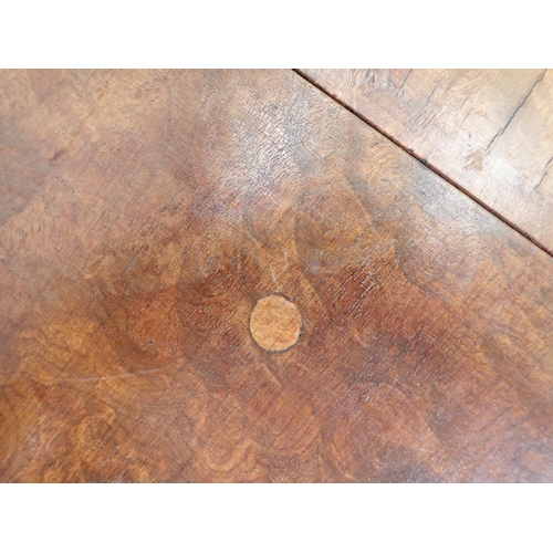 456 - A walnut dropleaf Dining Table with crossbanded oval top, raised on shell carved cabiole legs, 3ft W