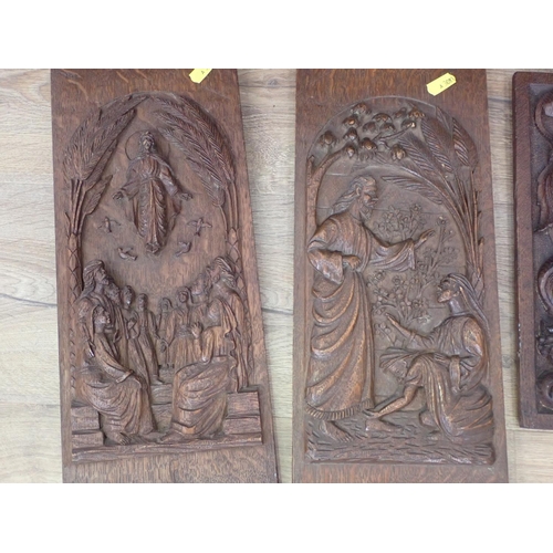 473 - Four various carved panels, mostly religious subjects, 2ft 9in to 12in