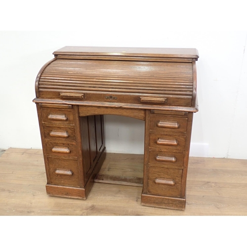 475 - An oak roll top Desk, 3ft 6in W