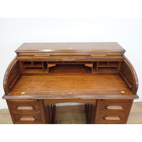 475 - An oak roll top Desk, 3ft 6in W