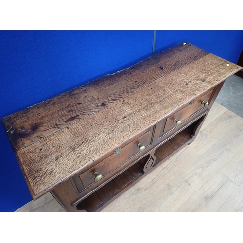 501 - An 18th Century oak Potboard Dresser fitted two drawers above a pierced fiddle leg and shaped end su... 