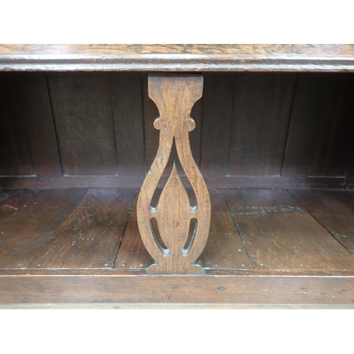 501 - An 18th Century oak Potboard Dresser fitted two drawers above a pierced fiddle leg and shaped end su... 