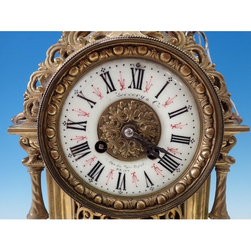 504 - A French Mantel Clock with urn finial, circular dial and shell and scroll detail, 19in H