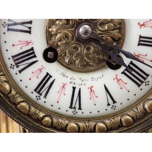 504 - A French Mantel Clock with urn finial, circular dial and shell and scroll detail, 19in H