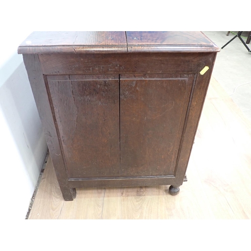 521 - An early 18th Century oak Mule Chest with hinged top, panelled front above a pair of drawers, 4ft 2i... 