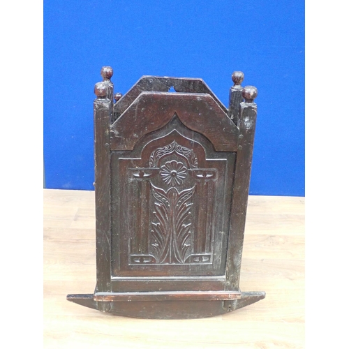 540 - An antique oak Rocking Cradle with carved panels and turned finials, possibly lacking canopy, 3ft L