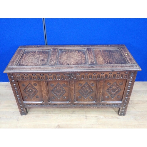 547 - A 17th Century carved oak Coffer with panelled hinged cover and four panel lozenge carved front, 4ft... 