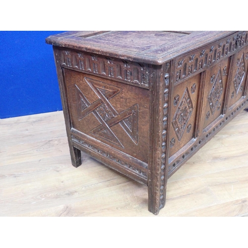 547 - A 17th Century carved oak Coffer with panelled hinged cover and four panel lozenge carved front, 4ft... 