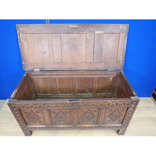 547 - A 17th Century carved oak Coffer with panelled hinged cover and four panel lozenge carved front, 4ft... 