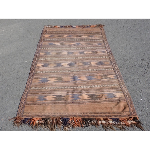 55 - A Kelim Rug with multi borders and all over rows of stylised designs, 9ft 7in x 4ft 6in (moth damage... 