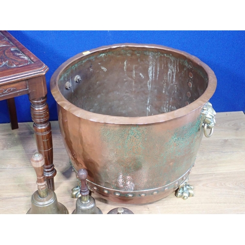 565 - An antique copper Log Cauldron with brass lion mask handles and paw feet, 19in Diameter, two Hand Be... 