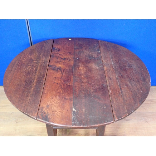 572 - An antique oak dropleaf Table with oval top on squared supports and stretchers, 3ft 7in W