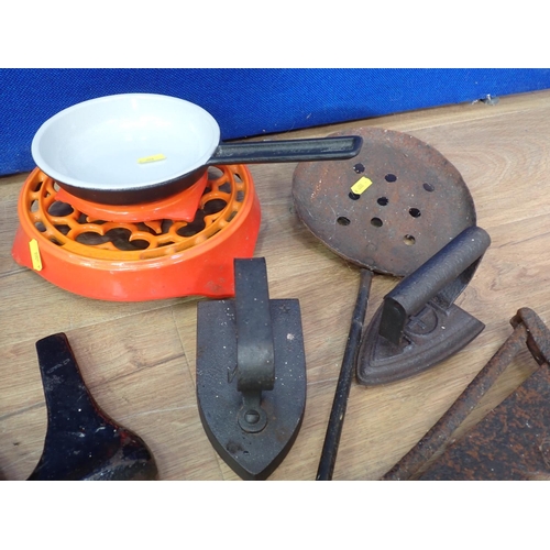 589 - A metal covered Pot, a Fire Sway, Flat Irons, brass Weights, etc