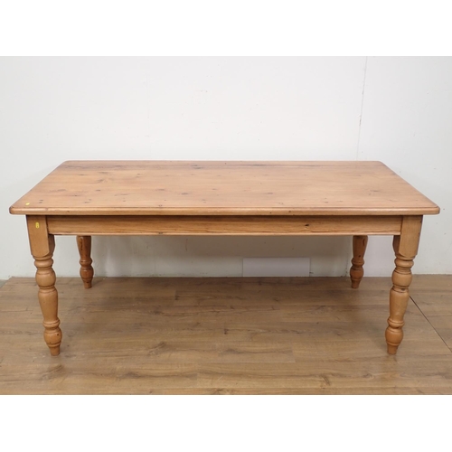 60 - A large pine Dining Table and eight Chairs, the table with turned supports, 6ft L x 3ft W