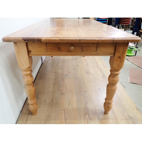 60 - A large pine Dining Table and eight Chairs, the table with turned supports, 6ft L x 3ft W