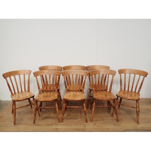 60 - A large pine Dining Table and eight Chairs, the table with turned supports, 6ft L x 3ft W