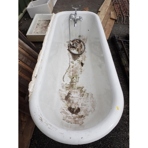 621 - A heavy cast iron roll top iron Bath with cast ball and claw supports, some scratching and rubbing i... 