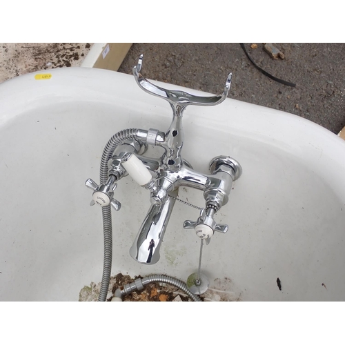 621 - A heavy cast iron roll top iron Bath with cast ball and claw supports, some scratching and rubbing i... 