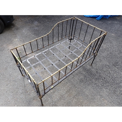 624 - A brass and black painted Cot (two casters missing)