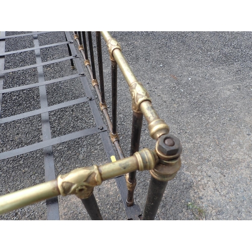 624 - A brass and black painted Cot (two casters missing)