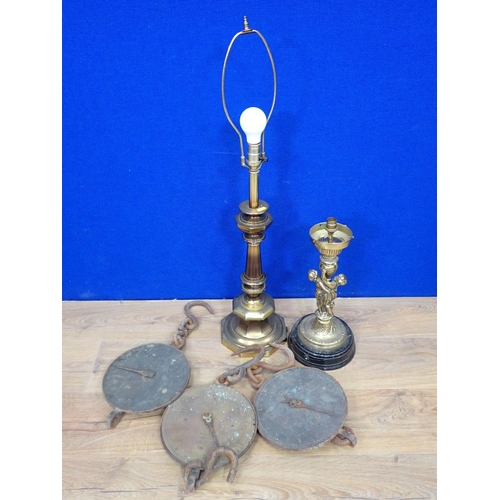 65 - Two copper Pans, wooden mounted Shields, three sets of Weighing Scales, a brass figural table Lamp a... 