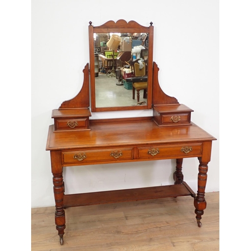 70 - An Edwardian walnut Dressing Table fitted two frieze drawers on turned supports and casters, 4ft W