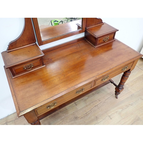 70 - An Edwardian walnut Dressing Table fitted two frieze drawers on turned supports and casters, 4ft W