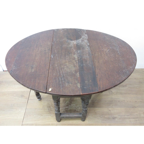 89 - An antique oak Gateleg Table with oval top, fitted frieze drawer on turned supports and squared stre... 