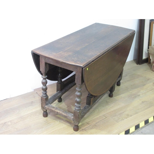 90 - A large antique oak Gateleg Table with oval top on bobbin turned supports and squared stretchers, 4f... 