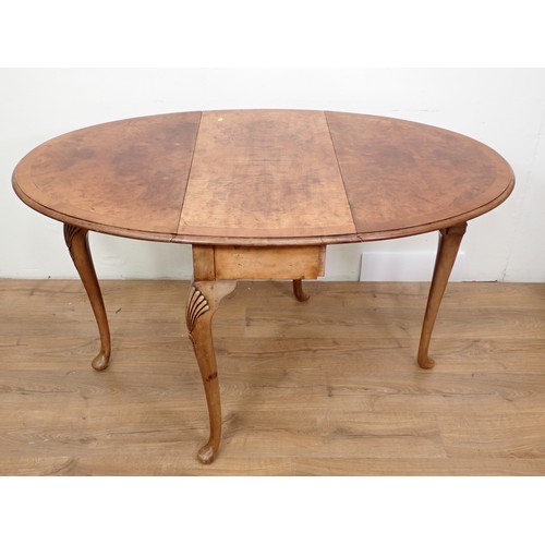 456 - A walnut dropleaf Dining Table with crossbanded oval top, raised on shell carved cabiole legs, 3ft W