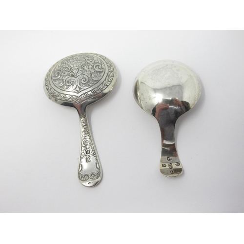 819 - A George III silver Caddy Spoon engraved shield cartouche, Birmingham 1808, and another, Sheffield 1... 