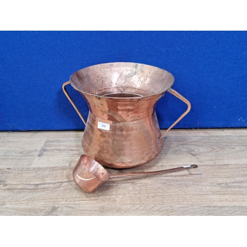 64 - A copper two handled Water Carrier with Ladle