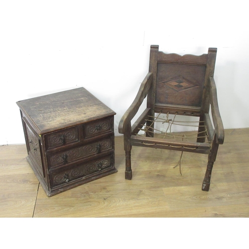 109 - An antique oak Coal Box simulated as a carved chest of drawers with hinged cover, 1ft 5in H x 1ft 7i... 